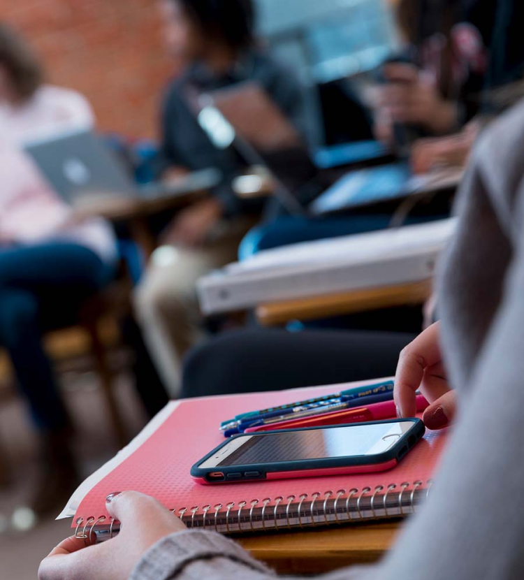 Photo of student and their study material.