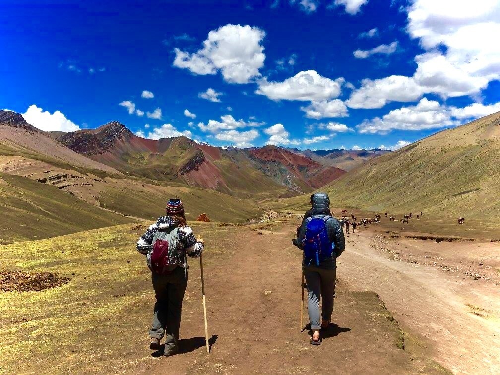 Two C S B and S J U students hiking in the mountains during an international exchange program.