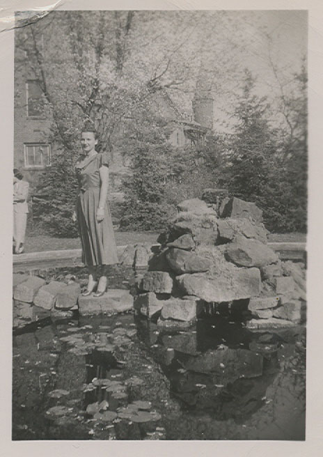 Woman standing by the pond