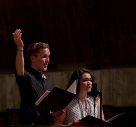 Male and female in a church singing