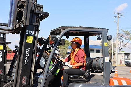 Gaby driving forklift