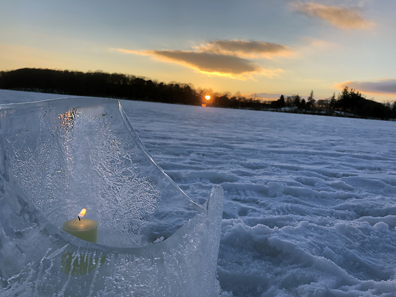 icy luminary, lit at sunset