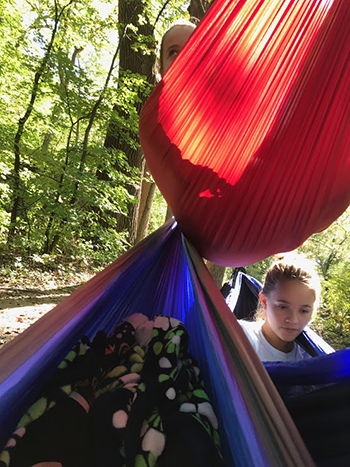 Isabella Bovee, studying in hammocks with friends at CSB/SJU.