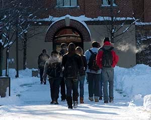 Photo of Johnnies walking in the snow to the Refectory