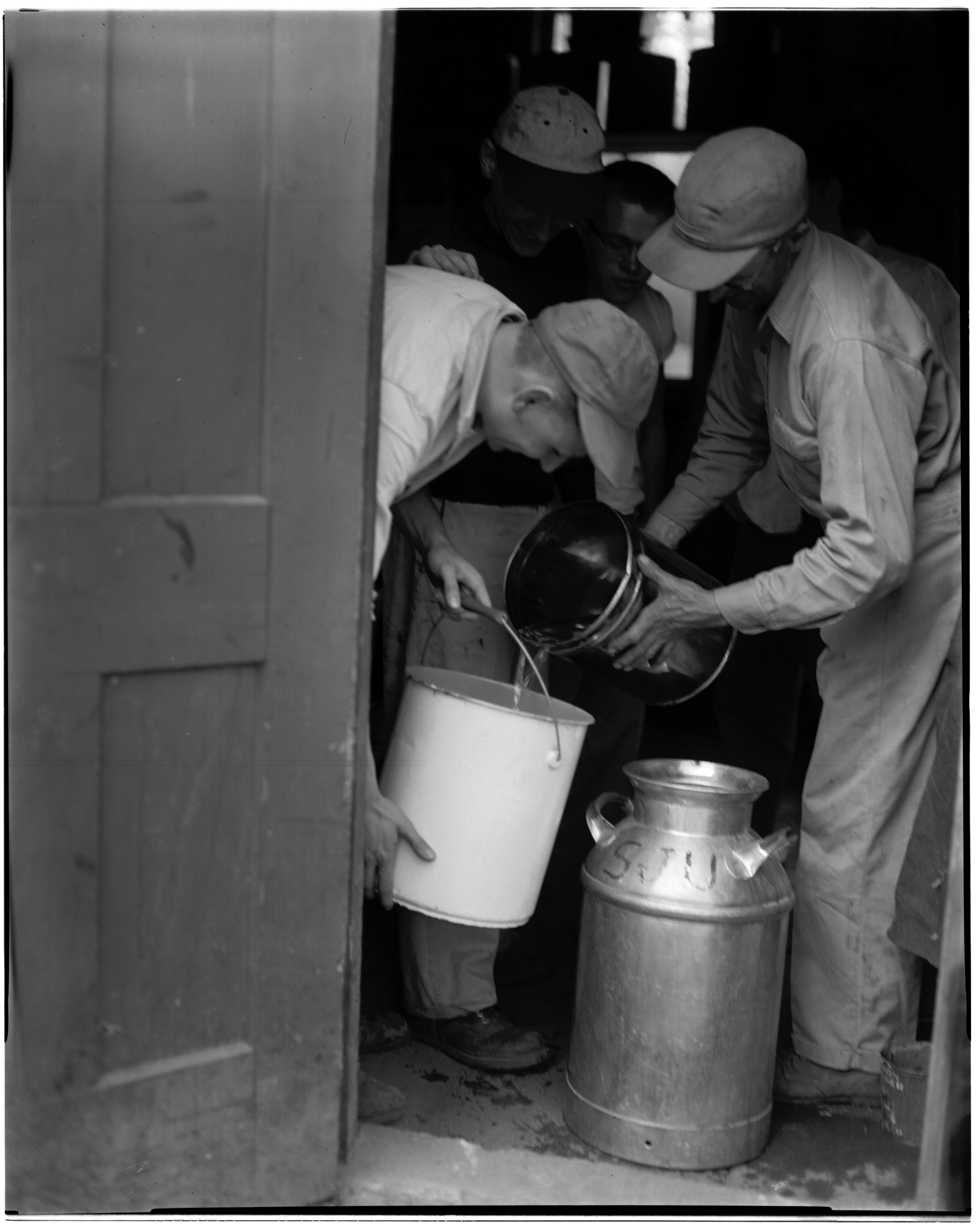 Students helping to store sap in the Sugar Shack, 1959