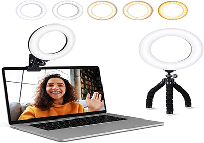 A laptop displaying a woman with curly hair waving, illuminated by a clip-on ring light. Below, a flexible tripod ring light is shown. Various light color temperatures are displayed above: white, warm white, and yellow.