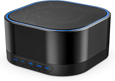 A compact black Bluetooth speaker with a square shape and rounded edges. It has a textured top surface and blue LED accents. Control buttons, including power, volume, and play/pause, are located on the front panel.