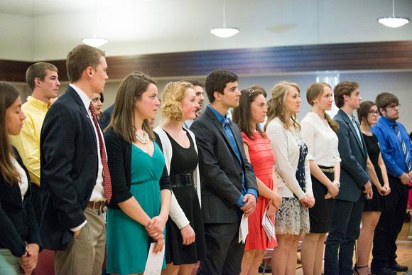 New student members learn about the history of Phi Beta Kappa at the spring induction ceremony.