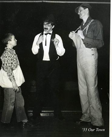 Three actors perform a scene from a play. One wears a vest and bow tie with a fake mustache, another wears overalls and a hat, and the third is a child in a patterned shirt. The image is labeled "'55 Our Town.