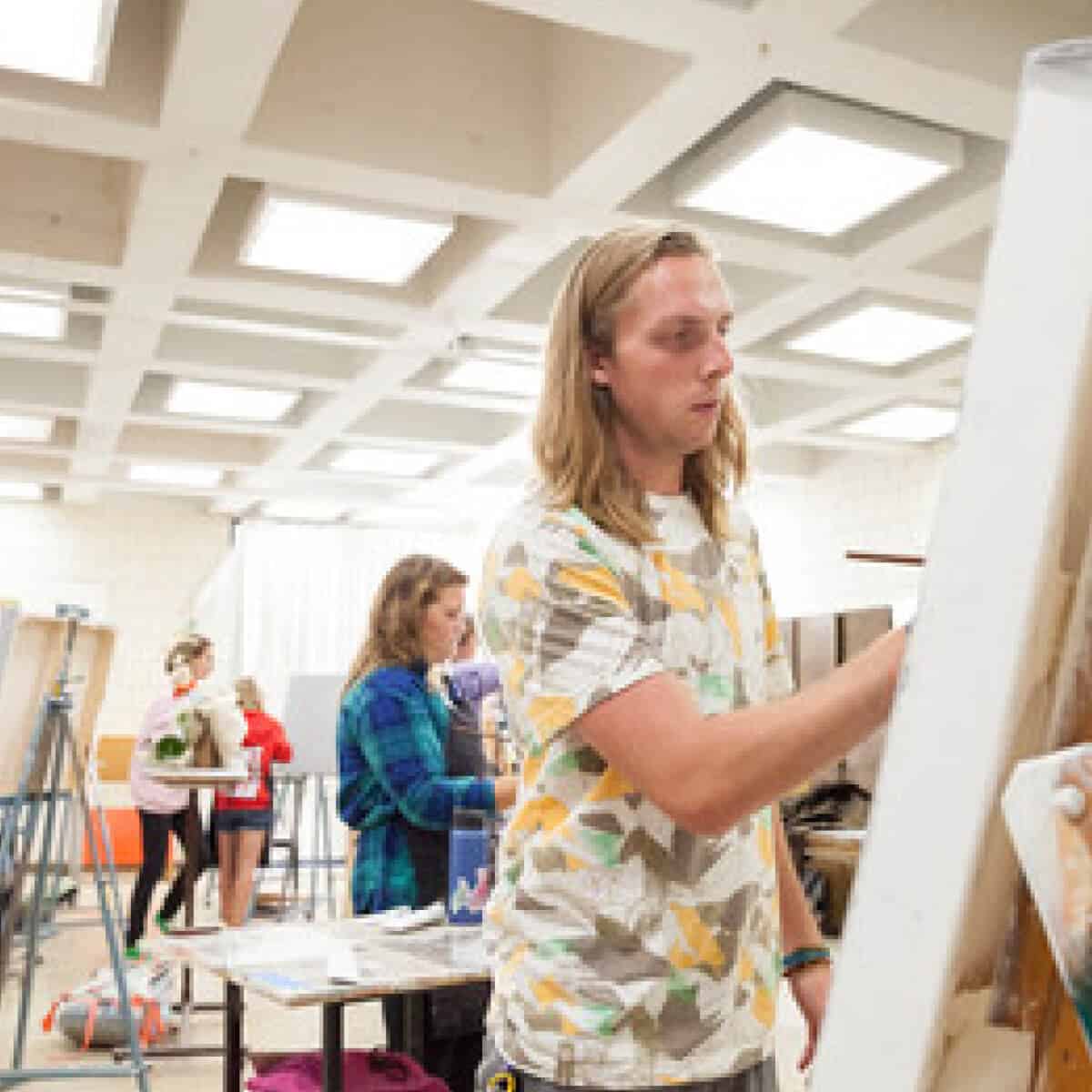 Saint John's art student demonstrates patience while painting.  