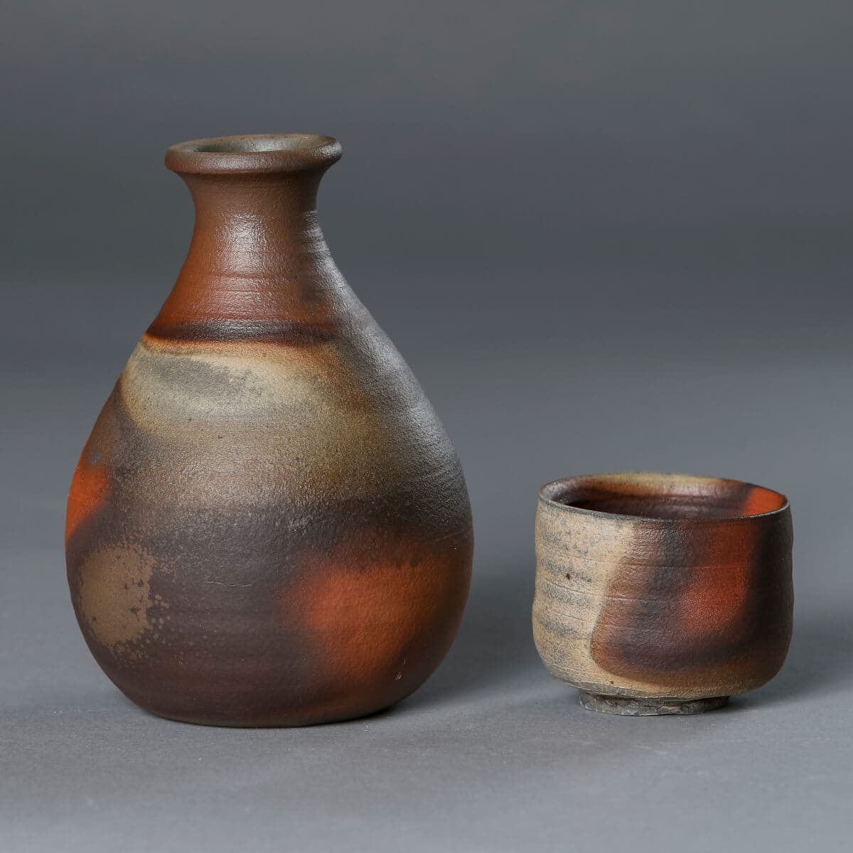 Well-designed vase and coffee cup produced by the Abbey ceramics studio. 