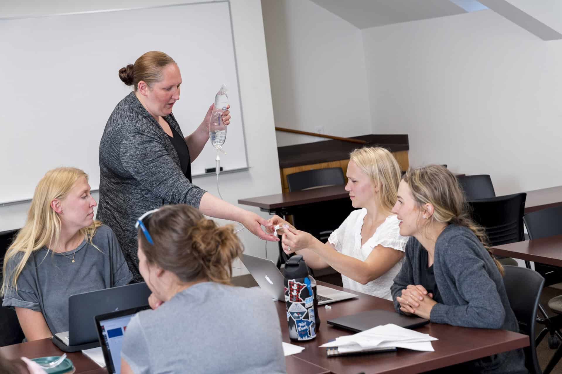 C S B Nursing students learn fundamental skills in the classroom. 