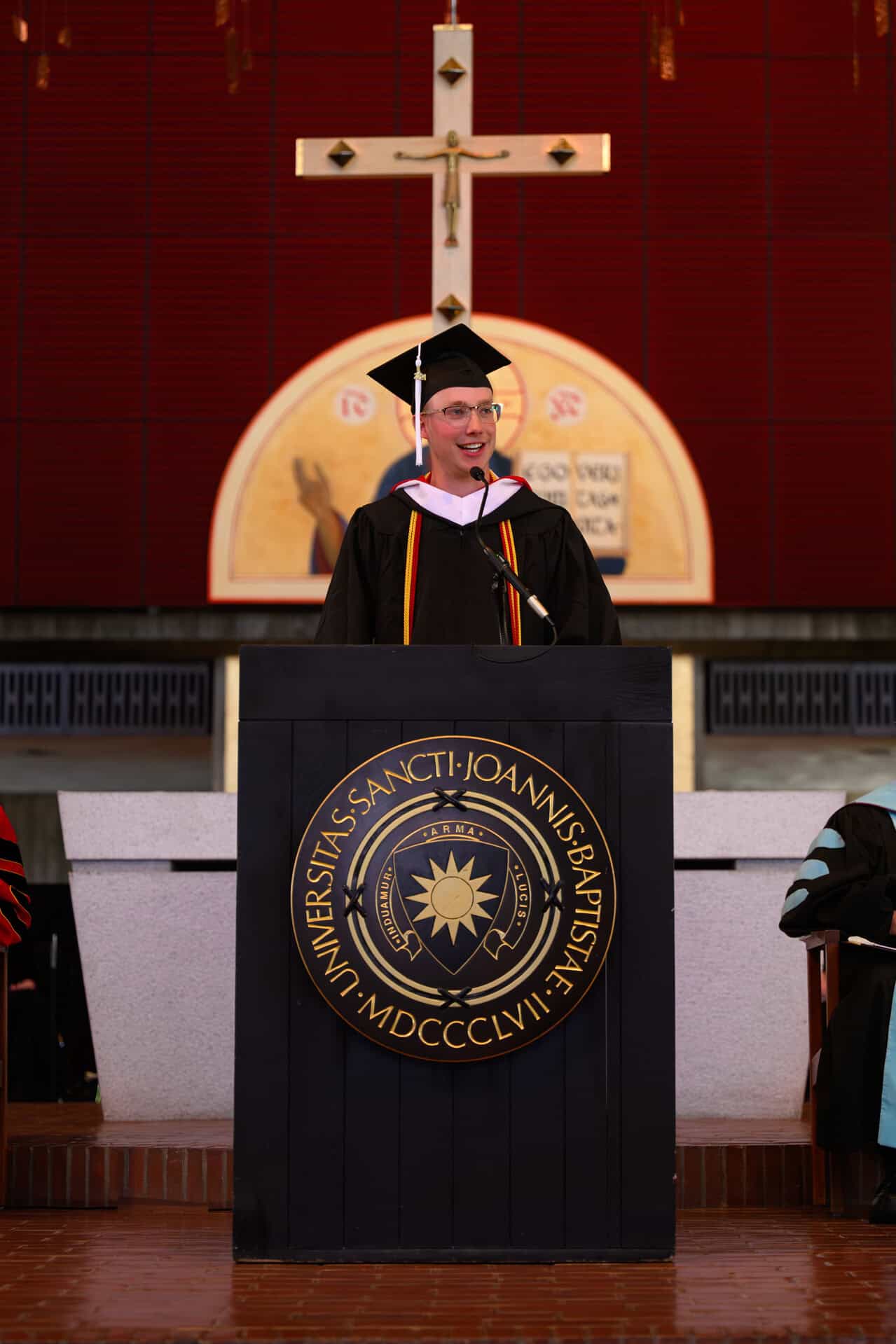 S J U student commencement speaker gives his humorous yet profound graduation speech. 